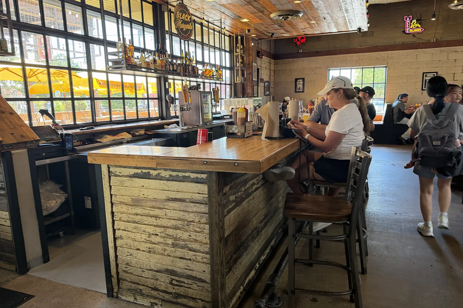 Full bar at the back of the Terry Black’s dining room