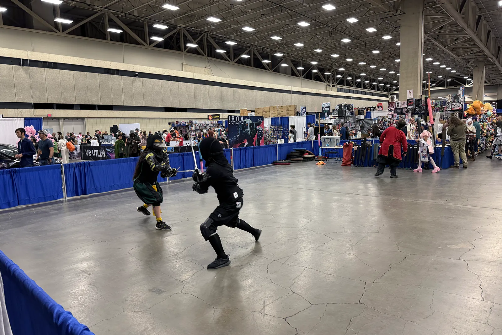 Sword fighting demonstration on the FAN EXPO Dallas show floor
