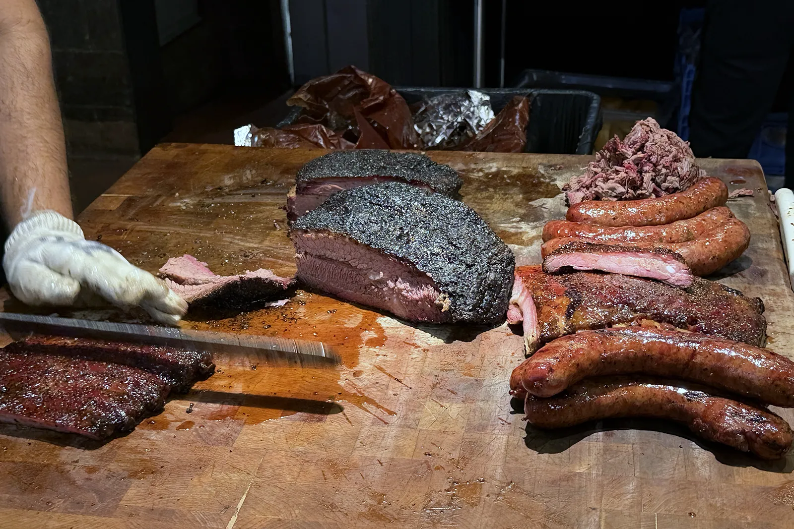 Brisket, ribs and sausages ready at the Terry Black’s carving counter
