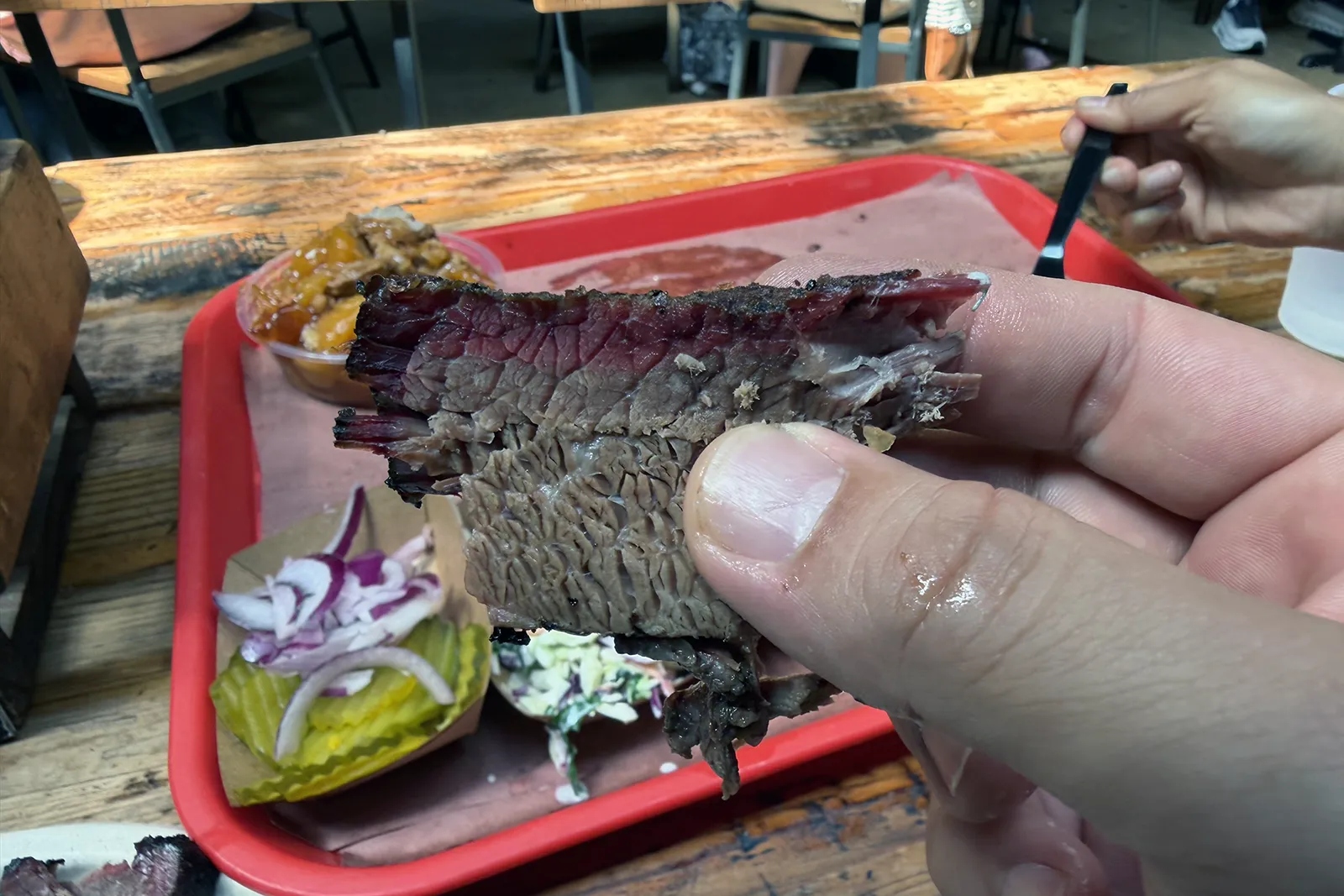Close view of smoked brisket at Terry Black’s Barbecue
