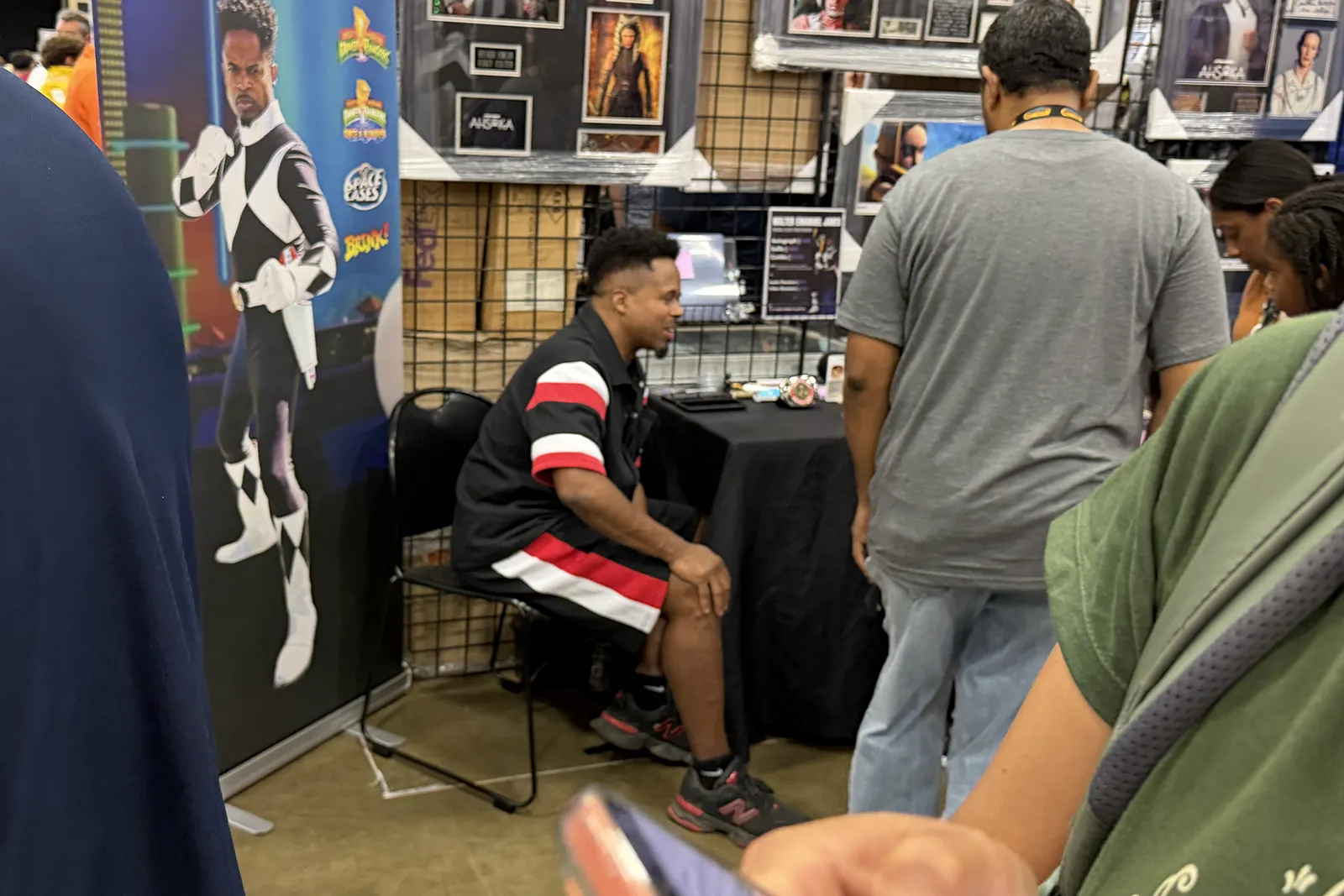 Fans visiting the Black Power Ranger guest table at FAN EXPO Dallas