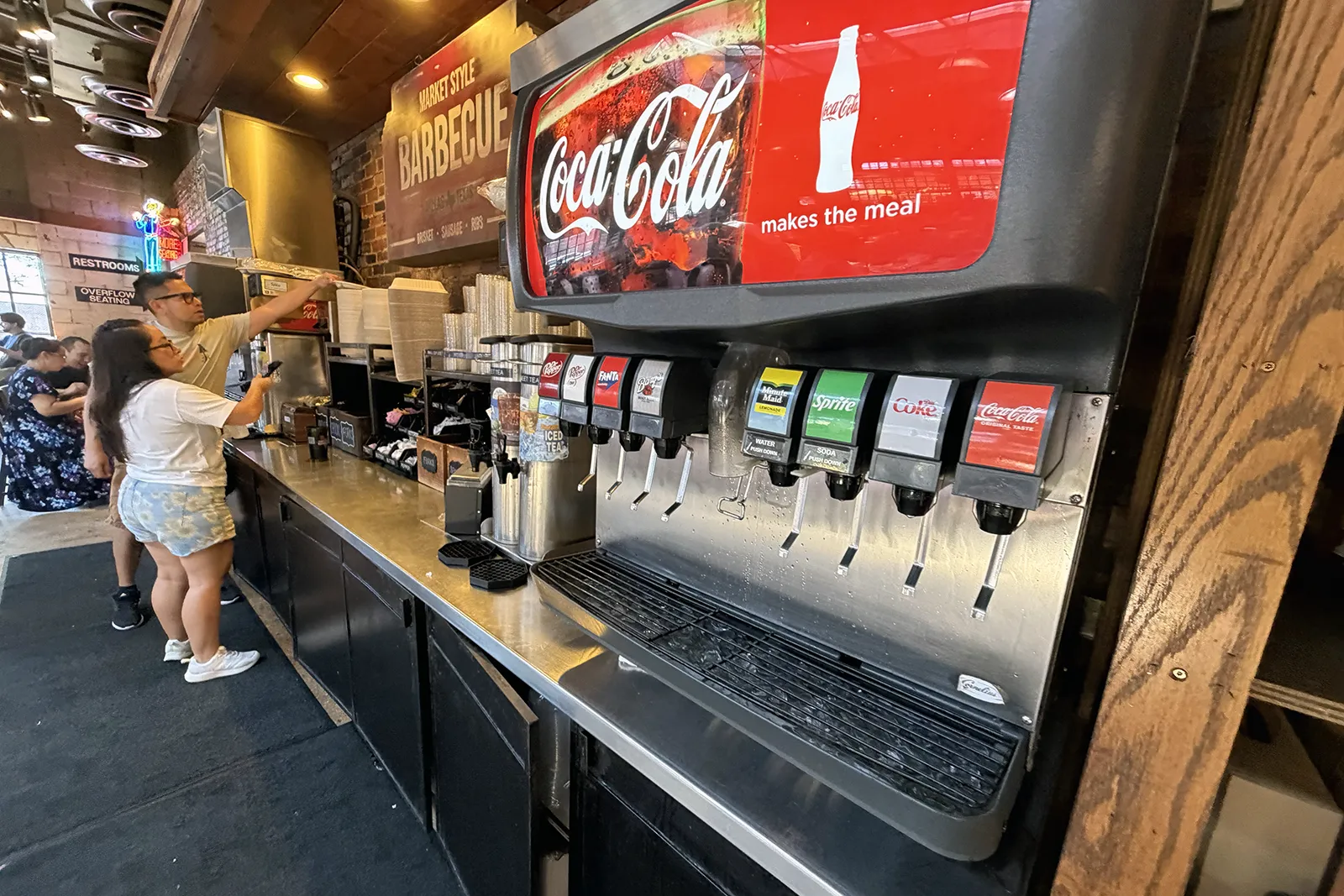 Soda machines and the water and iced tea station at Terry Black’s