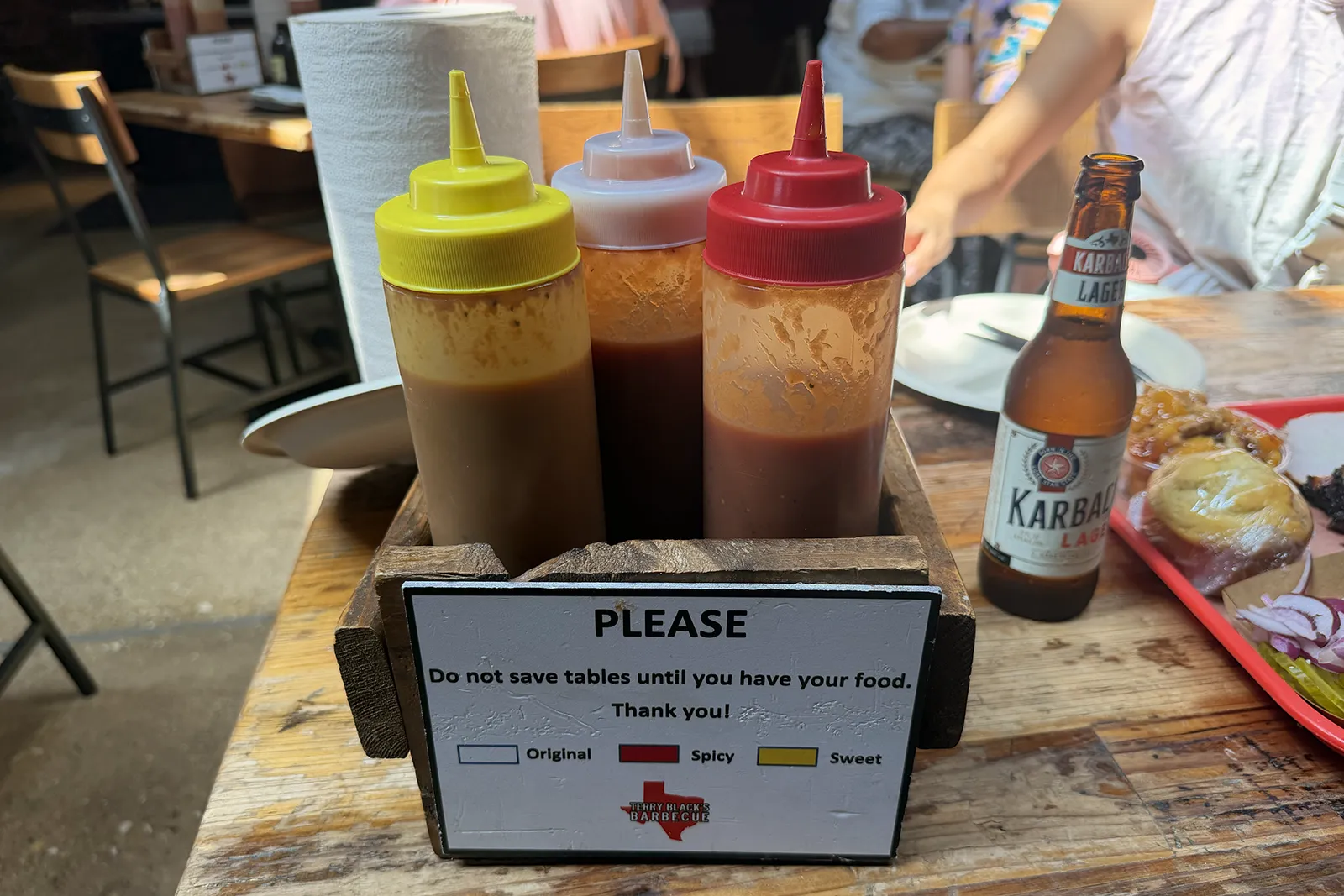 Three Terry Black’s barbecue sauces on our table
